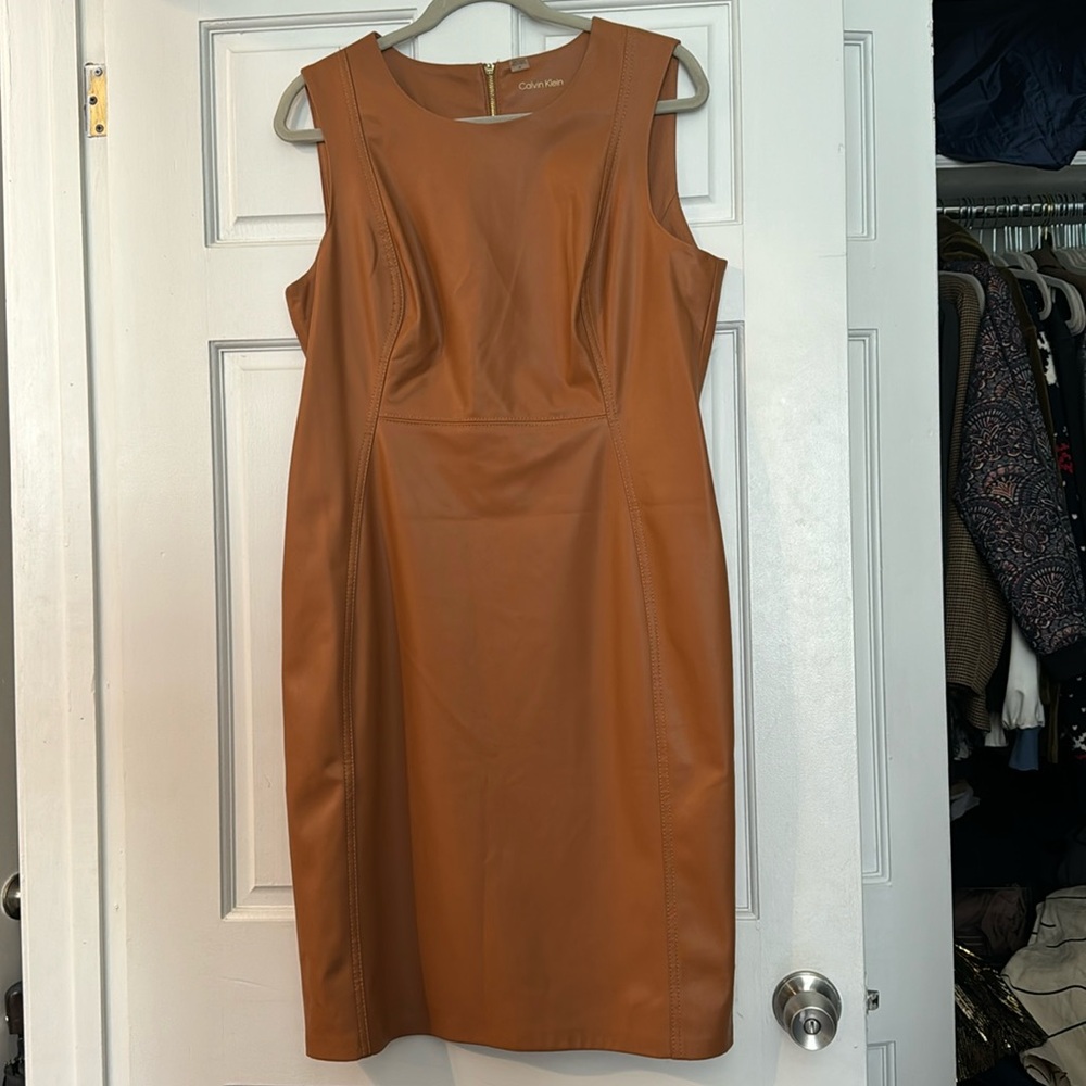 NWOT Calvin Klein cognac leather dress. Lined inside with comfortable fabric.